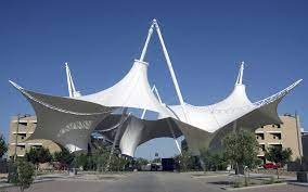 A tensile structure is a type of construction that uses tension to support loads, such as a building's roof or an outdoor canopy. 